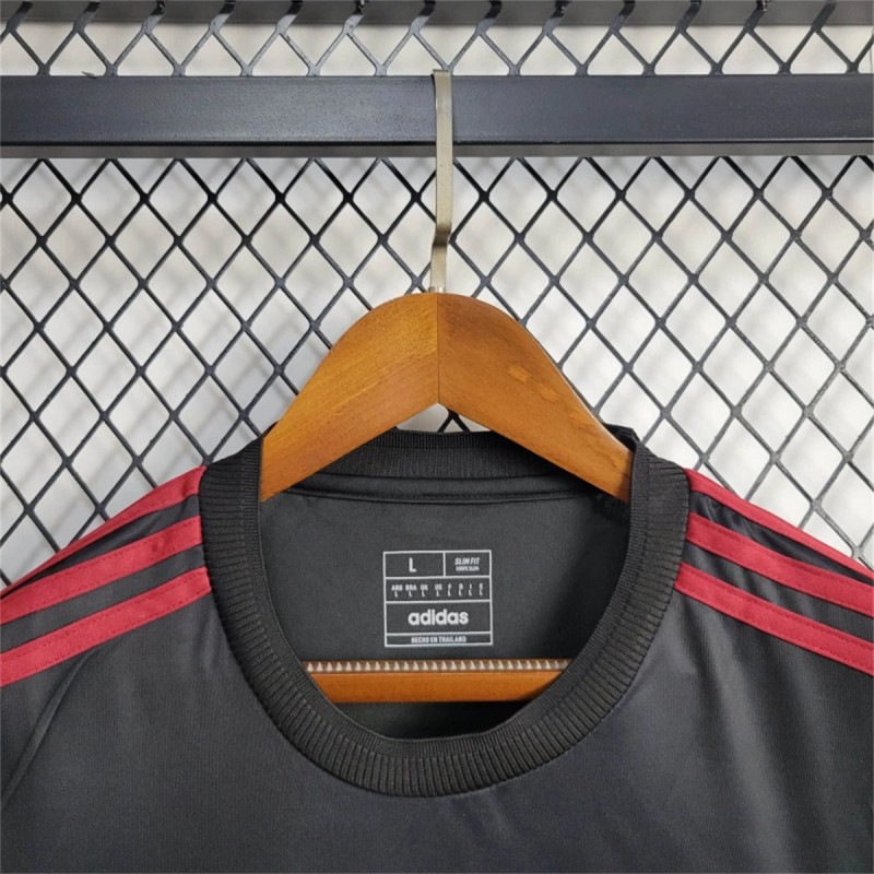 25/26 Manchester United New Year Training Black/Red Jersey